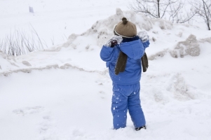 A child playing in the snow 127054913294a